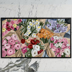Flower bouquets art on a black TV on a white marble wall
