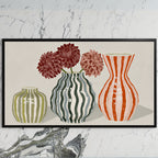 Striped vases art on a black TV on a white marble wall
