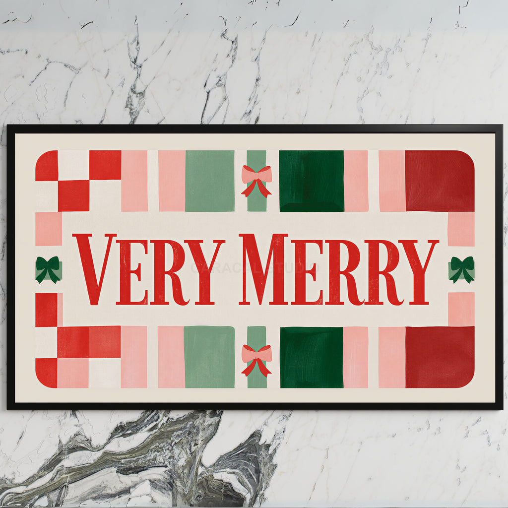 Very Merry typography art on a black TV on a white marble wall