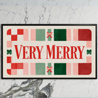 Very Merry typography art on a black TV on a white marble wall