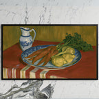Vintage carrot still life art on a black TV on a white marble wall
