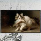 Kitten with a big fish art on a black TV on a white marble wall