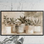 Neutral succulent pots art on a black TV on a white marble wall