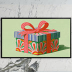 Gift box art on a black TV on a white marble wall