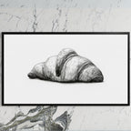 Croissant etching art on a black TV on a white marble wall