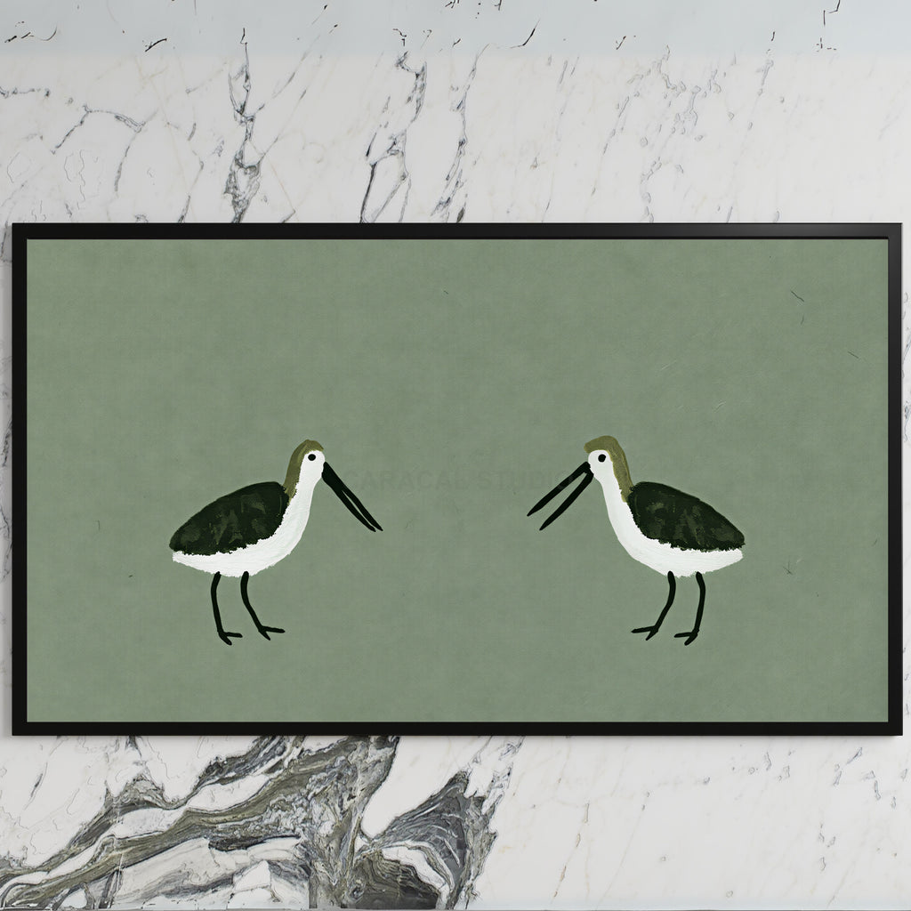 Two shorebirds art on a black TV on a white marble wall