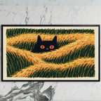 Black cat in grass art on a black TV on a white marble wall