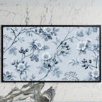 Toile wild roses art on a black TV on a white marble wall