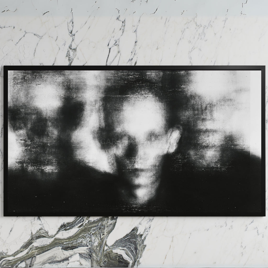 Blurred faces art on a black TV on a white marble wall