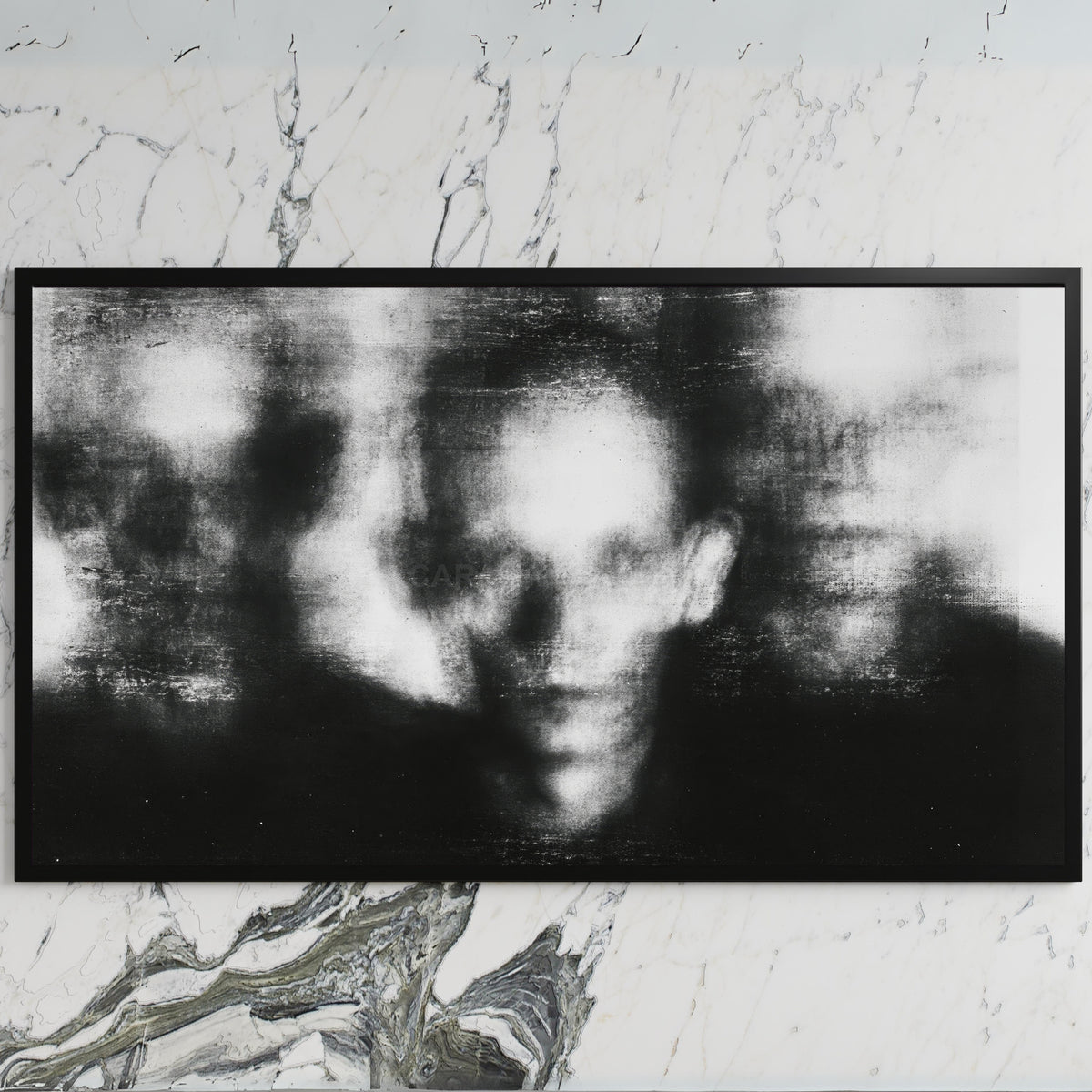 Blurred faces art on a black TV on a white marble wall