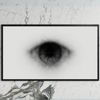 Black and white eye art on a black TV on a white marble wall