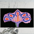 Surreal flower art on a black TV on a white marble wall