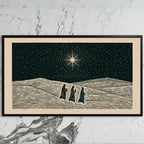 Three wise men art on a black TV on a white marble wall