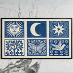 Celestial folk art on a black TV on a white marble wall