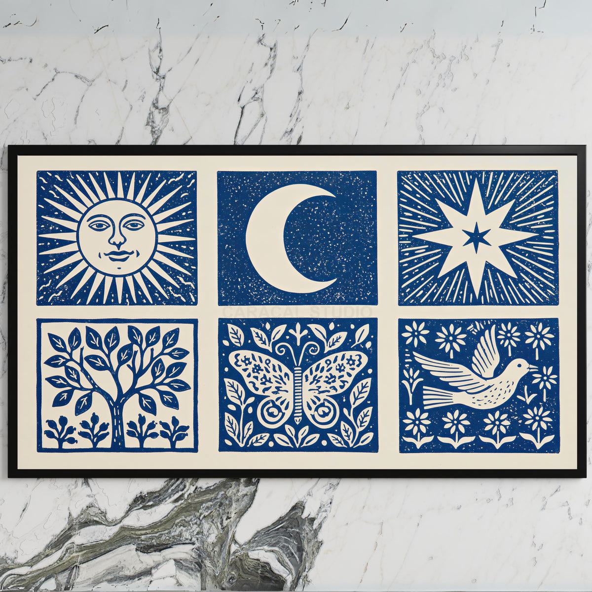 Celestial folk art on a black TV on a white marble wall