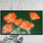 Blurred orange poppies art on a black TV on a white marble wall