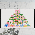 Pink bow Christmas tree art on a black TV on a white marble wall