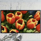 Orange tulip bouquet art on a black TV on a white marble wall