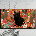 Black cat in a flower garden art on a black TV on a white marble wall