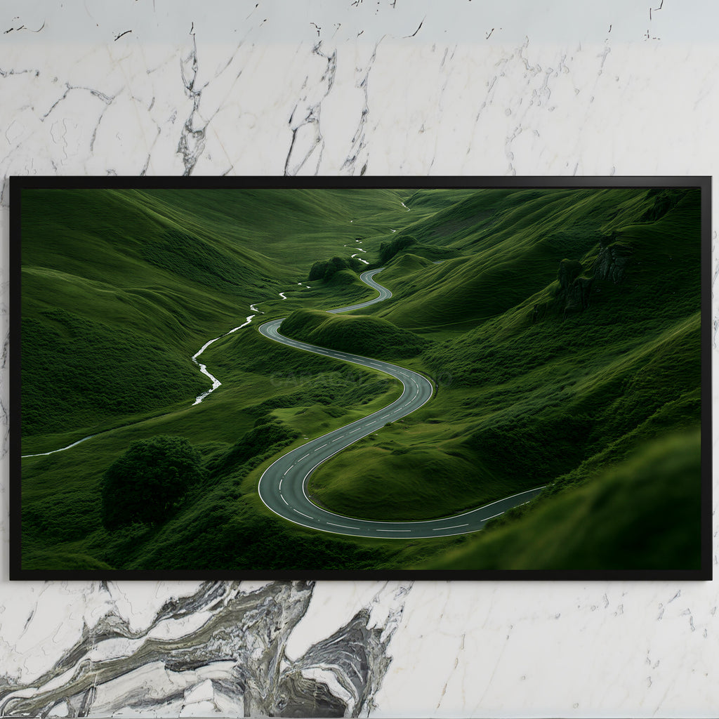 Winding road landscape art on a black TV on a white marble wall