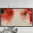 Red pencil eyes art on a black TV on a white marble wall