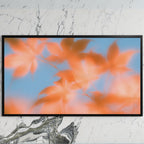 Autumn leaves art on a black TV on a white marble wall