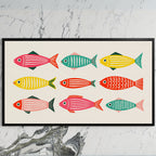 Folk fish art on a black TV on a white marble wall