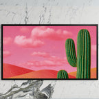 Saguaro cactus art on a black TV on a white marble wall