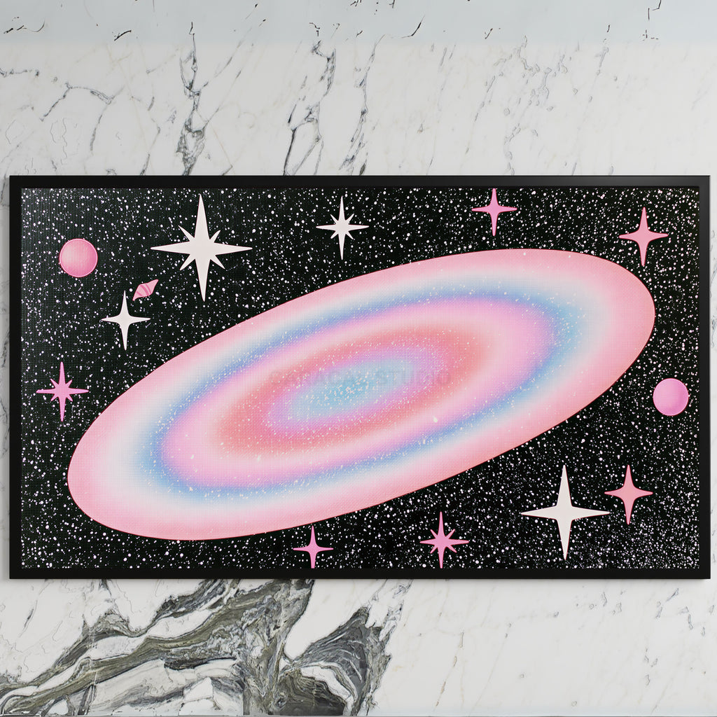 Pastel galaxy art on a black TV on a white marble wall