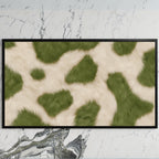 Olive cowhide art on a black TV on a white marble wall