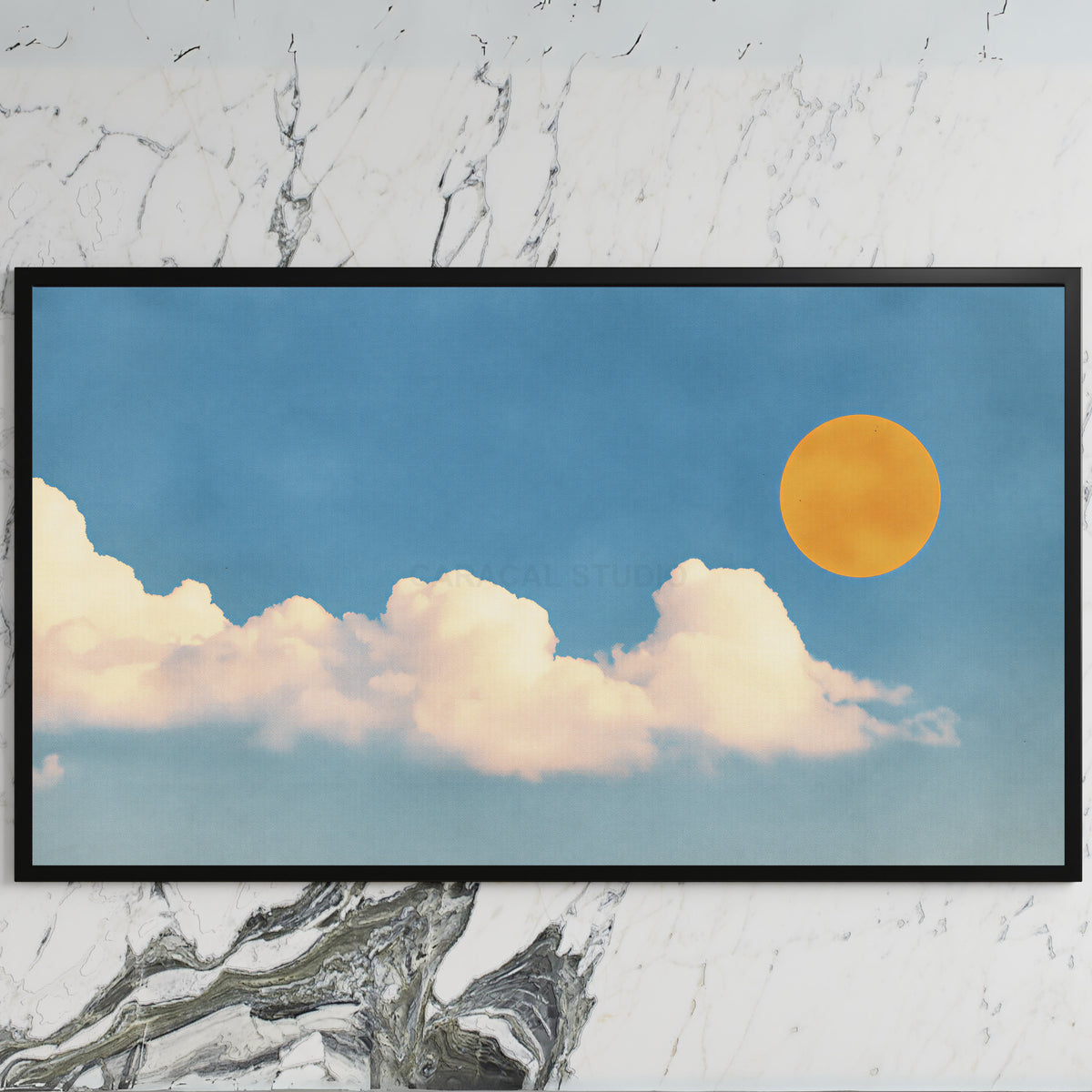 Sun and clouds art on a black TV on a white marble wall