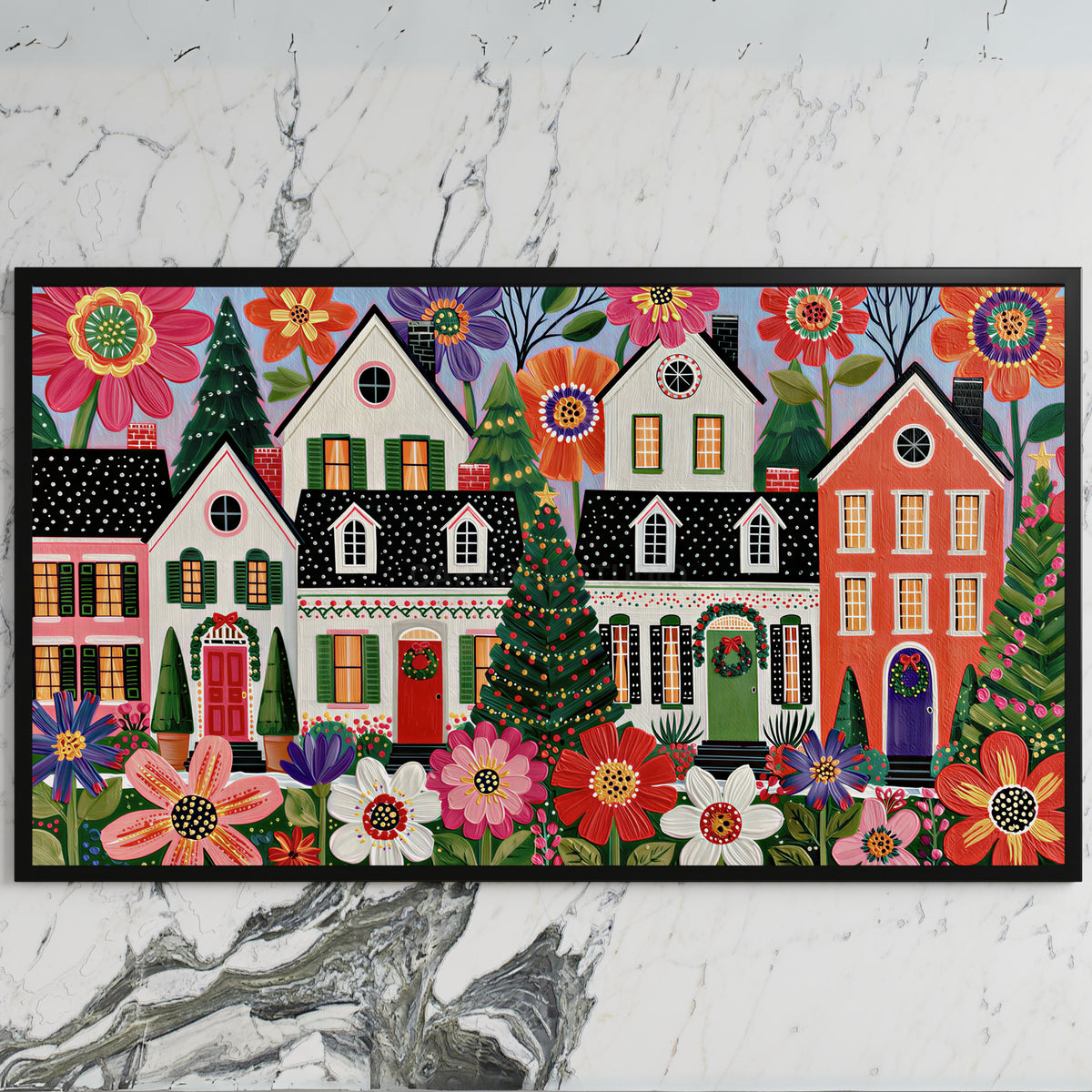 Folk art Christmas village art on a black TV on a white marble wall