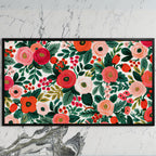 Painted roses and berries art on a black TV on a white marble wall