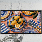 Mediterranean lemons art on a black TV on a white marble wall