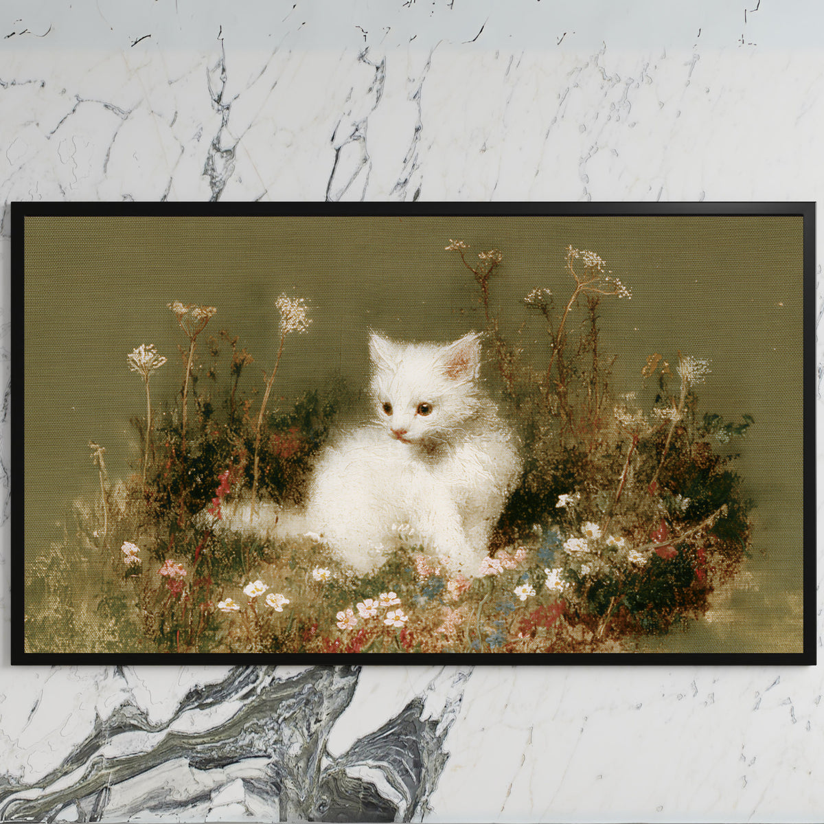 White kitten art on a black TV on a white marble wall