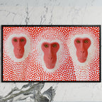 Snow monkeys with red dots art on a black TV on a white marble wall