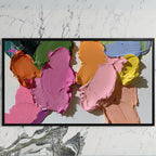 Pastel paint strokes art on a black TV on a white marble wall