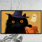 Black cat in a witch hat art on a black TV on a white marble wall
