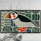 Folk art puffin art on a black TV on a white marble wall