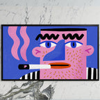Pop art face art on a black TV on a white marble wall