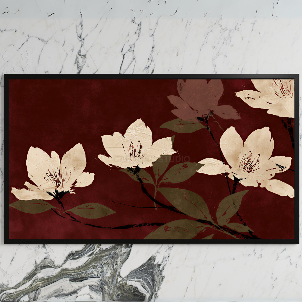 Cream blossoms on burgundy art on a black TV on a white marble wall
