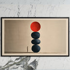 Stacked stones art on a black TV on a white marble wall