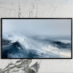Ocean waves art on a black TV on a white marble wall