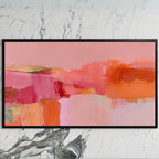 Pink abstract color blocks art on a black TV on a white marble wall