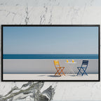 Ocean view terrace art on a black TV on a white marble wall