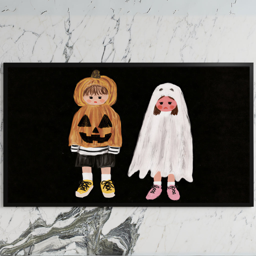 Trick-or-treaters art on a black TV on a white marble wall