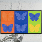 Pop art butterfly art on a black TV on a white marble wall