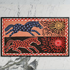 Folk star horses art on a black TV on a white marble wall