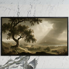 Vintage tree landscape art on a black TV on a white marble wall