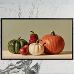 Pumpkin still life art on a black TV on a white marble wall